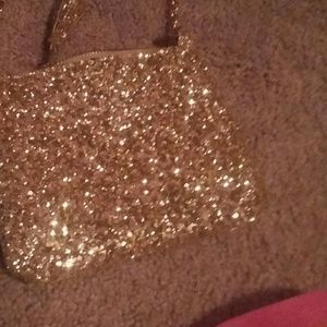 A purse that is gold from Old Navy